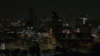 5.7K aerial stock footage orbit apartment and office high-rises at night, Downtown Memphis, Tennessee Aerial Stock Footage | DX0002_187_056