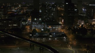 5.7K aerial stock footage approaching apartment high-rise and parking garage at night, Downtown Memphis, Tennessee Aerial Stock Footage | DX0002_187_065