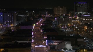 5.7K aerial stock footage fly around arena to reveal Beale Street at nighttime, Downtown Memphis, Tennessee Aerial Stock Footage | DX0002_188_013