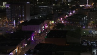 DX0002_188_035 - 5.7K aerial stock footage flyby clubs and restaurants on Beale Street at nighttime, Downtown Memphis, Tennessee