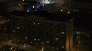 5.7K aerial stock footage approach and fly away from an office building at nighttime, Memphis, Tennessee Aerial Stock Footage | DX0002_188_042