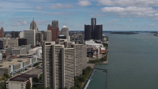 5.7K aerial stock footage of flying away from skyscrapers and skyline, Downtown Detroit, Michigan Aerial Stock Footage | DX0002_189_001