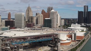 DX0002_189_016 - 5.7K aerial stock footage flying by apartment towers, arena and convention center, focus on skyline, Downtown Detroit, Michigan