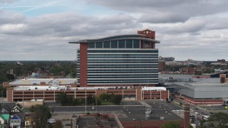 5.7K aerial stock footage of ascending past MotorCity Casino Hotel in Detroit, Michigan Aerial Stock Footage | DX0002_190_001