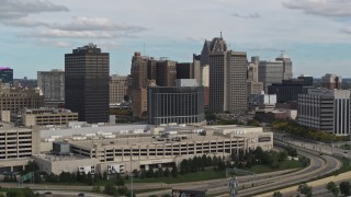 5.7K aerial stock footage ascend past hotel with view of skyscrapers, Downtown Detroit, Michigan Aerial Stock Footage | DX0002_190_003