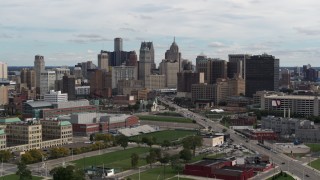 DX0002_190_023 - 5.7K aerial stock footage descend past the towering skyscrapers in the downtown skyline, Downtown Detroit, Michigan