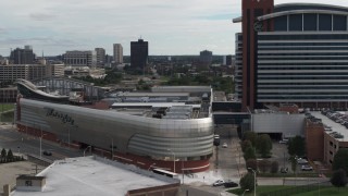 DX0002_190_025 - 5.7K aerial stock footage closely orbiting the MotorCity Casino Hotel near Downtown Detroit, Michigan