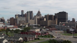 5.7K aerial stock footage ascending past the giant towers in the downtown skyline, Downtown Detroit, Michigan Aerial Stock Footage | DX0002_190_028