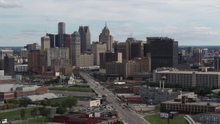 DX0002_190_031 - 5.7K aerial stock footage descend past tall skyscrapers in the city's skyline, Downtown Detroit, Michigan