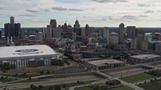 5.7K aerial stock footage the skyline behind Ford Field and Comerica Park stadiums, Downtown Detroit, Michigan Aerial Stock Footage | DX0002_191_010