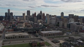 5.7K aerial stock footage the skyline behind Comerica Park stadium, Downtown Detroit, Michigan Aerial Stock Footage | DX0002_191_011