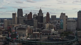 5.7K aerial stock footage of the downtown skyline while flying by baseball stadium, Downtown Detroit, Michigan Aerial Stock Footage | DX0002_191_020