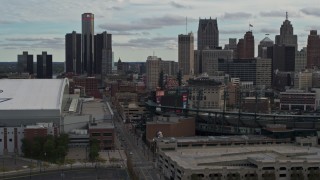 5.7K aerial stock footage descend past stadiums, focus on the skyline in Downtown Detroit, Michigan Aerial Stock Footage | DX0002_191_035