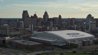 5.7K aerial stock footage of slowly passing the football stadium and the city skyline at sunset in Downtown Detroit, Michigan Aerial Stock Footage | DX0002_191_043