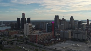 5.7K aerial stock footage a view of tall skyscrapers behind a hotel at sunset, Downtown Detroit, Michigan Aerial Stock Footage | DX0002_192_006