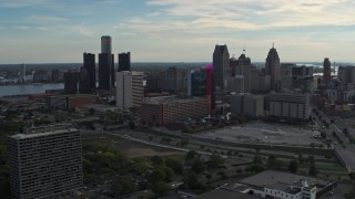 5.7K aerial stock footage slowly flying by tall skyscrapers behind a hotel at sunset, Downtown Detroit, Michigan Aerial Stock Footage | DX0002_192_008