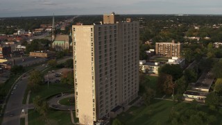 5.7K aerial stock footage orbit side of the City Place Detroit apartment building at sunset, Detroit, Michigan Aerial Stock Footage | DX0002_192_013