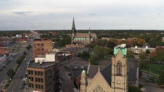 5.7K aerial stock footage of a view of a church at sunset, Detroit, Michigan Aerial Stock Footage | DX0002_192_019