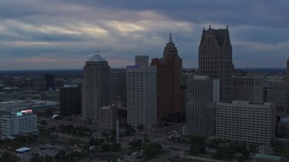 5.7K aerial stock footage flyby skyscrapers and reveal GM Renaissance Center at sunset, Downtown Detroit, Michigan Aerial Stock Footage | DX0002_192_044