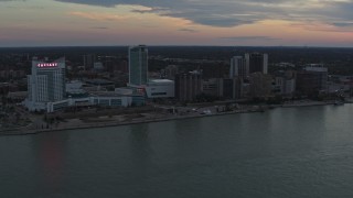 DX0002_192_049 - 5.7K aerial stock footage the city's skyline across the Detroit River, Windsor, Ontario, Canada, sunset