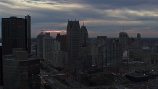 5.7K aerial stock footage flyby skyscrapers at sunset, seen from GM Renaissance Center, Downtown Detroit, Michigan Aerial Stock Footage | DX0002_192_054