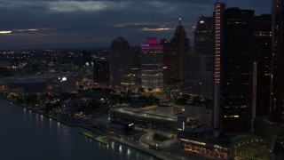 5.7K aerial stock footage orbit a group of tall skyscrapers at twilight, reveal GM Renaissance Center, Downtown Detroit, Michigan Aerial Stock Footage | DX0002_193_008