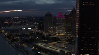 DX0002_193_010 - 5.7K aerial stock footage flyby GM Renaissance Center at twilight, reveal entrance to tunnel, Downtown Detroit, Michigan