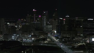 5.7K aerial stock footage of flying by the skyscrapers in the skyline at night, Downtown Detroit, Michigan Aerial Stock Footage | DX0002_193_028