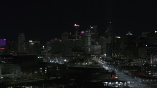 5.7K aerial stock footage of towering skyscrapers in city's skyline at night during descent, Downtown Detroit, Michigan Aerial Stock Footage | DX0002_193_036