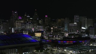 5.7K aerial stock footage flyby sports stadiums and skyline at night, Downtown Detroit, Michigan Aerial Stock Footage | DX0002_193_052