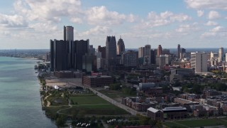 5.7K aerial stock footage of flying away from GM Renaissance Center and the city's skyline, Downtown Detroit, Michigan Aerial Stock Footage | DX0002_194_004