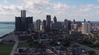 5.7K aerial stock footage of passing by GM Renaissance Center and the city's skyline, Downtown Detroit, Michigan Aerial Stock Footage | DX0002_194_006