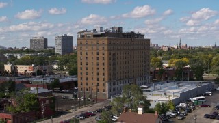 5.7K aerial stock footage of a stationary view of an apartment building in Detroit, Michigan Aerial Stock Footage | DX0002_194_013