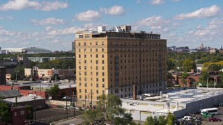 5.7K aerial stock footage of circling an apartment building in Detroit, Michigan Aerial Stock Footage | DX0002_194_015