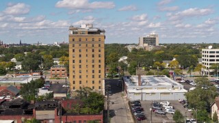 5.7K aerial stock footage of slowly orbiting an apartment building in Detroit, Michigan Aerial Stock Footage | DX0002_194_016