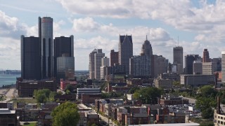 DX0002_194_022 - 5.7K aerial stock footage of towering GM Renaissance Center and the skyline in Downtown Detroit, Michigan