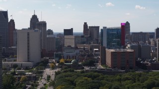 5.7K aerial stock footage of churches between office building and the hotel and casino, Downtown Detroit, Michigan Aerial Stock Footage | DX0002_194_041