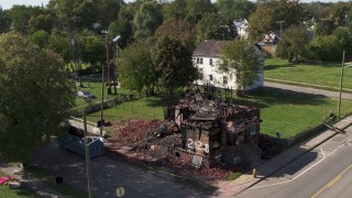 5.7K aerial stock footage approach and orbit a demolished home in Detroit, Michigan Aerial Stock Footage | DX0002_195_004