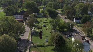 5.7K aerial stock footage of circling the Heidelberg Project art display in Detroit, Michigan Aerial Stock Footage | DX0002_195_005