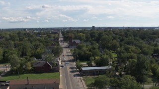 5.7K aerial stock footage of circling urban homes and a church on Mt Elliott Street, Detroit, Michigan Aerial Stock Footage | DX0002_195_015