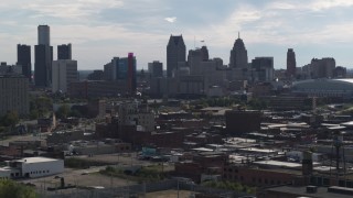 5.7K aerial stock footage focus on the city's skyline while flying past brick buildings, Downtown Detroit, Michigan Aerial Stock Footage | DX0002_195_027