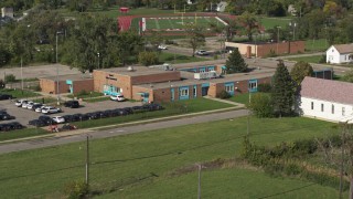 5.7K aerial stock footage of flying away from a police station in Detroit, Michigan Aerial Stock Footage | DX0002_195_029