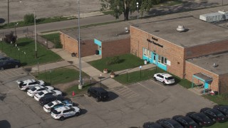 5.7K aerial stock footage of the police station's front entrance in Detroit, Michigan Aerial Stock Footage | DX0002_195_033