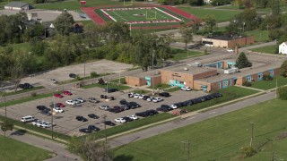 5.7K aerial stock footage fly toward a police station in Detroit, Michigan Aerial Stock Footage | DX0002_195_036