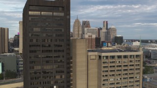 5.7K aerial stock footage flyby a group of skyscrapers to reveal office tower in Downtown Detroit, Michigan Aerial Stock Footage | DX0002_196_028