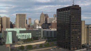 DX0002_196_029 - 5.7K aerial stock footage stationary view of skyscrapers between police headquarters and office tower in Downtown Detroit, Michigan