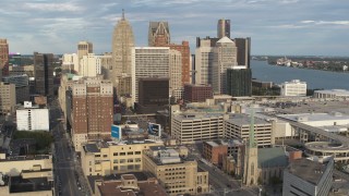 5.7K aerial stock footage of a reverse view of a group of skyscrapers in Downtown Detroit, Michigan Aerial Stock Footage | DX0002_196_035