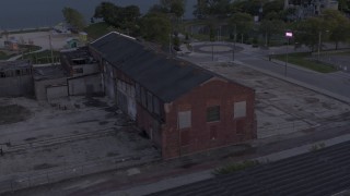 5.7K aerial stock footage of orbiting an abandoned Northern Cranes factory building at sunset, Detroit, Michigan Aerial Stock Footage | DX0002_197_012