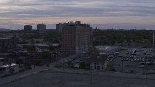 5.7K aerial stock footage focus on an apartment building during descent at sunset, Detroit, Michigan Aerial Stock Footage | DX0002_197_024