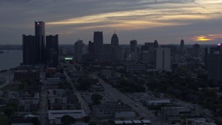 5.7K aerial stock footage slowly flying past GM Renaissance Center and the skyline at sunset, Downtown Detroit, Michigan Aerial Stock Footage | DX0002_197_040